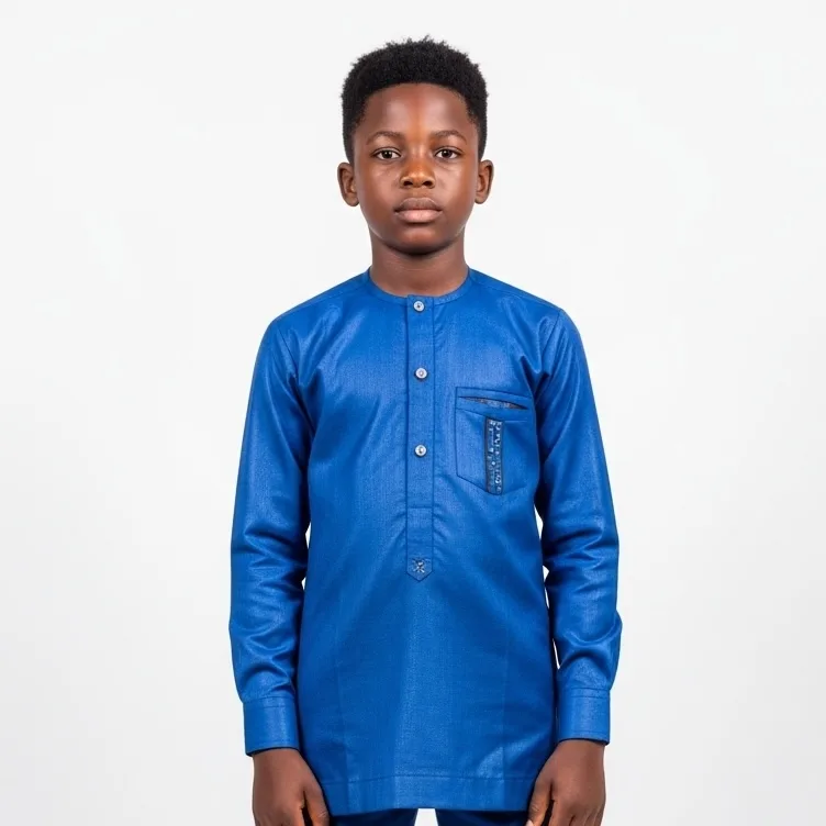 Boy wearing a royal blue long sleeve shirt with a chest pocket detail