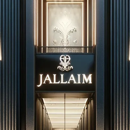 Elegant boutique entrance with an engraved brand name and a decorative emblem above the door