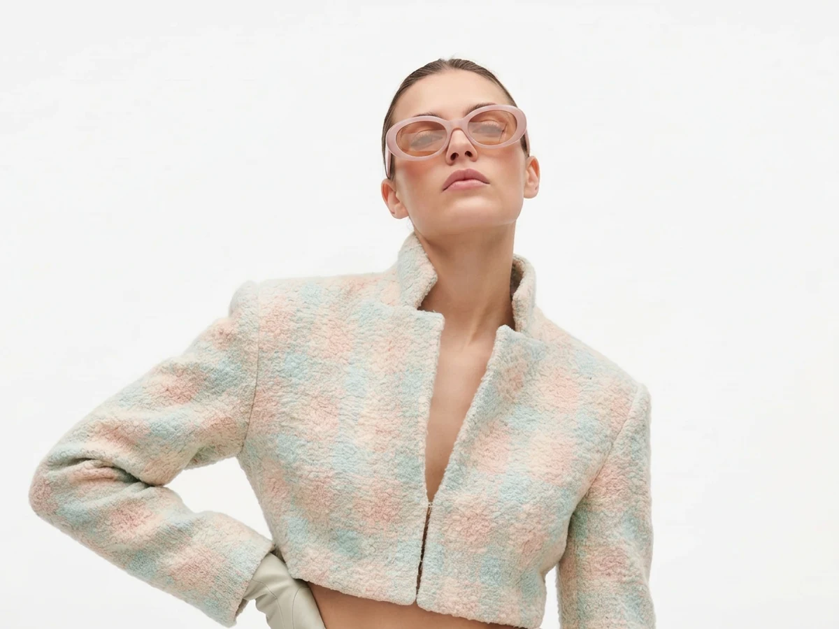 A model photographed still, the single frame the video is animated from