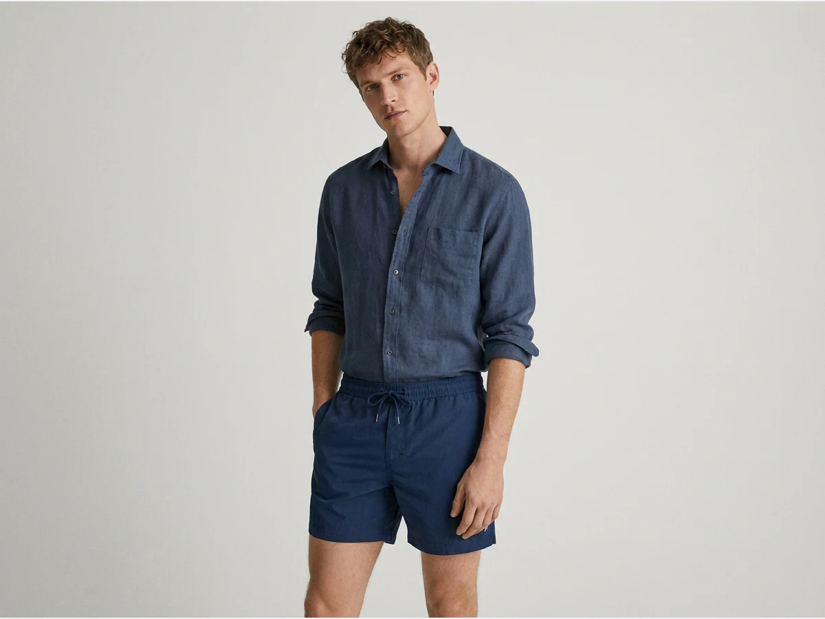 a model wearing swimwear, swim shorts on a male model