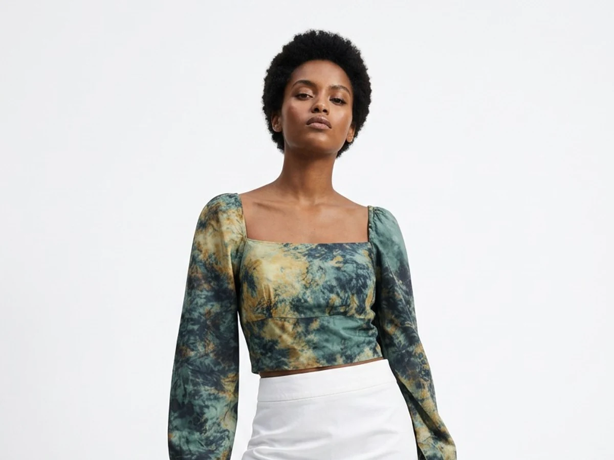 An AI model wearing the same top, generated from that single photograph