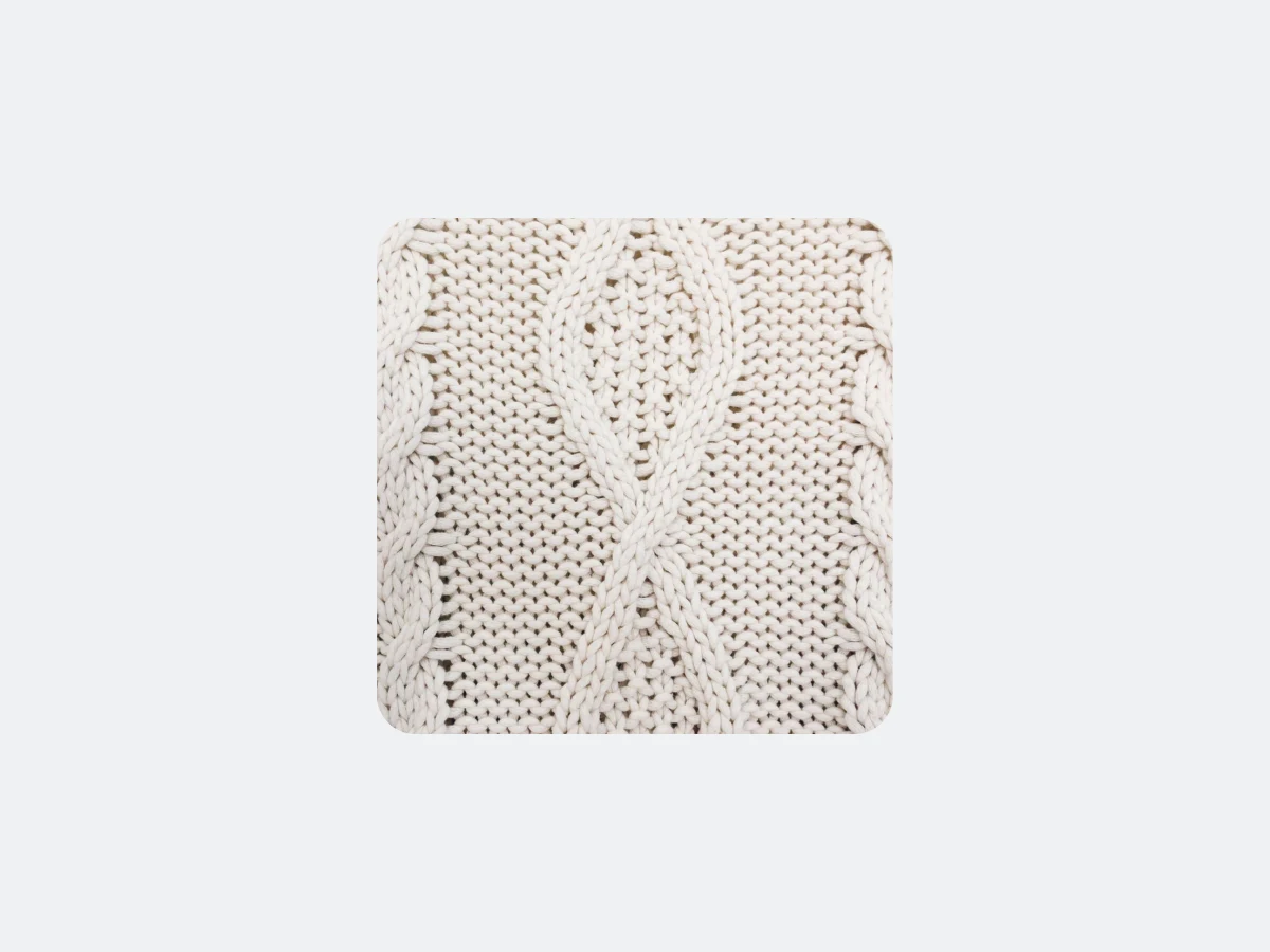 The cable knit chosen to replace it, uploaded beside the photograph