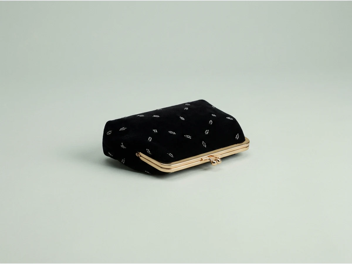 a designer handbag, product shot, a small evening clutch